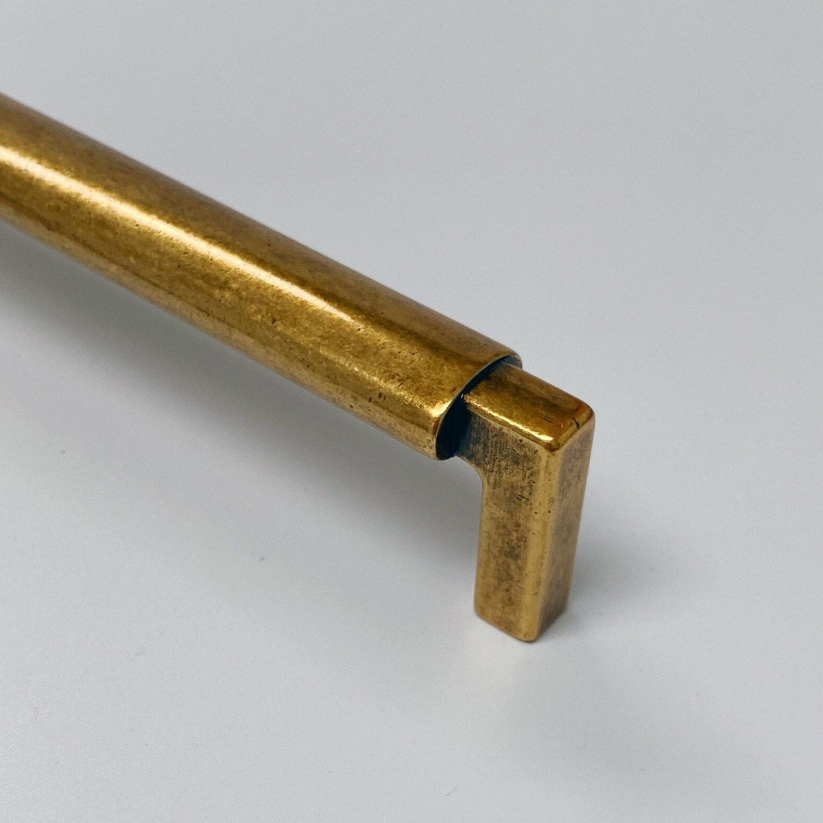 U-Shaped "Florence" Cabinet Knob and Drawer Pulls in Antique Brass.