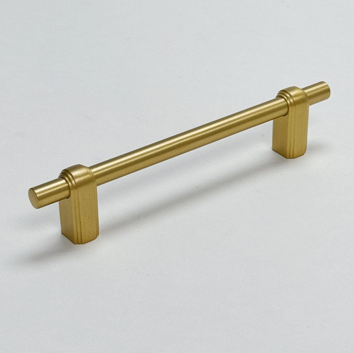 Satin Brass "Elliott" Drawer Pulls and Cabinet Knobs.