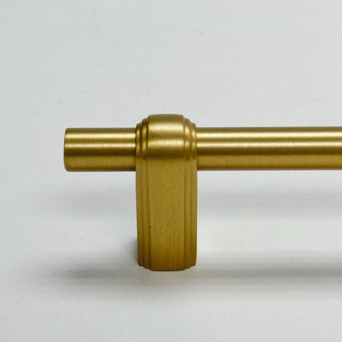 Satin Brass "Elliott" Drawer Pulls and Cabinet Knobs.