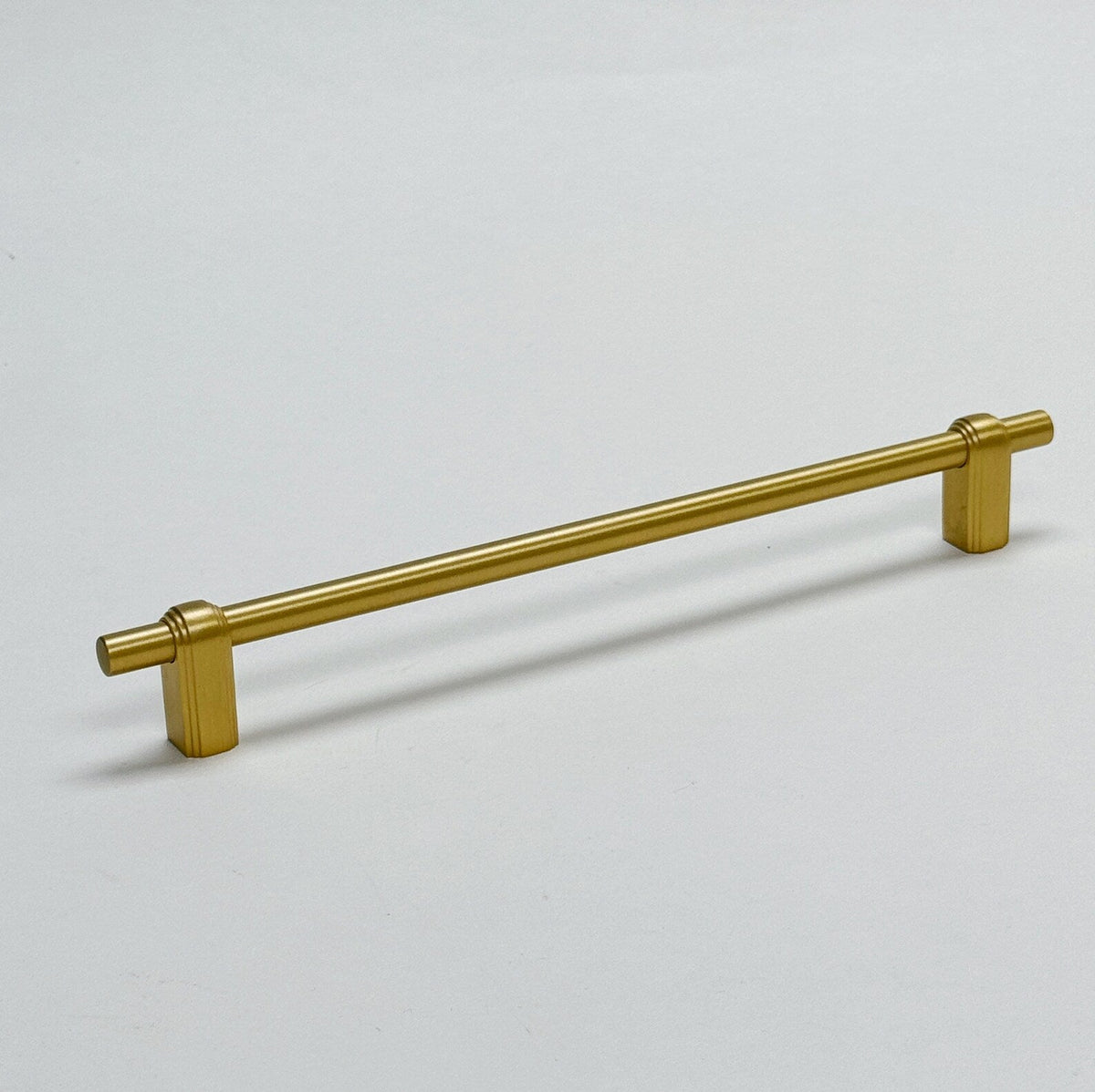 Satin Brass "Elliott" Drawer Pulls and Cabinet Knobs.