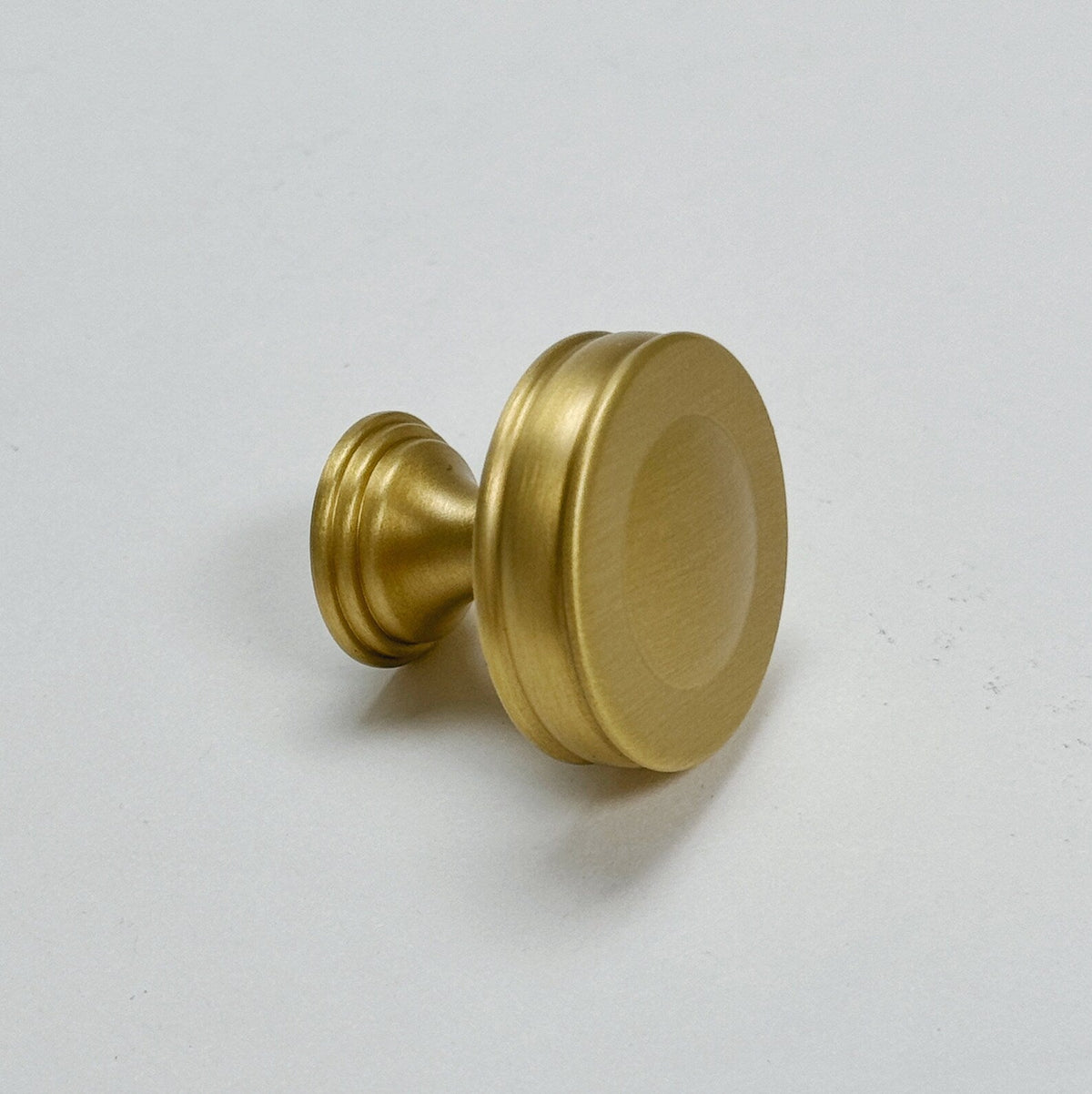 Satin Brass "Elliott" Drawer Pulls and Cabinet Knobs.