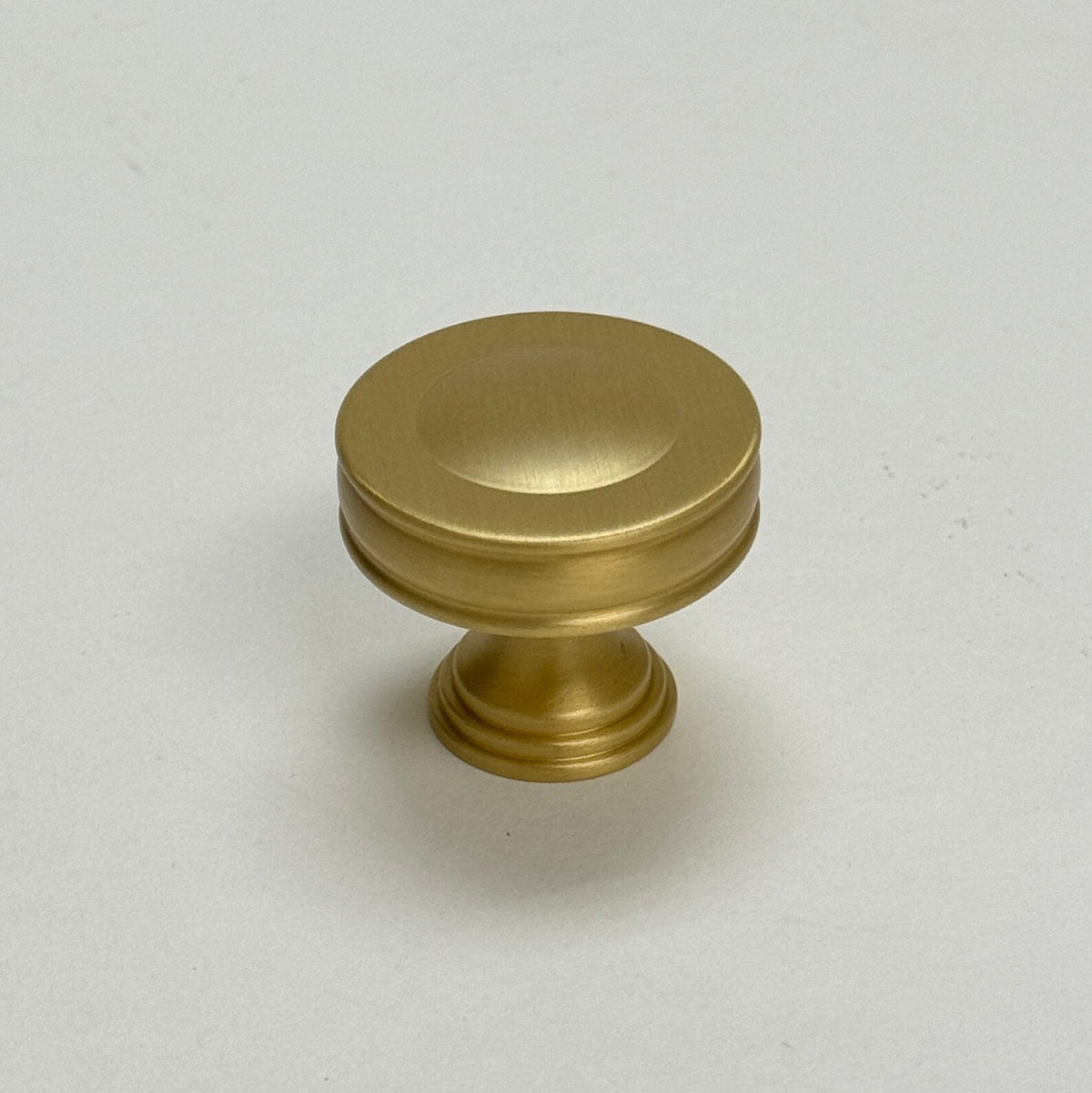 Satin Brass "Elliott" Drawer Pulls and Cabinet Knobs.