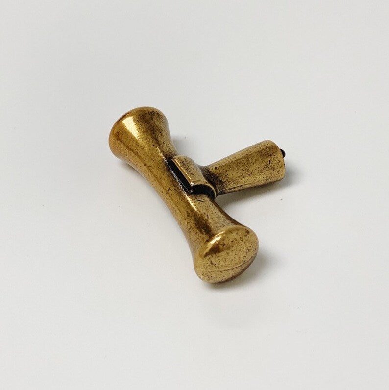 Hourglass "Tuscany" Drawer Pulls and Knobs in Antique Brass.