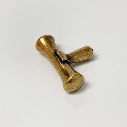 Hourglass "Tuscany" Drawer Pulls and Knobs in Antique Brass.
