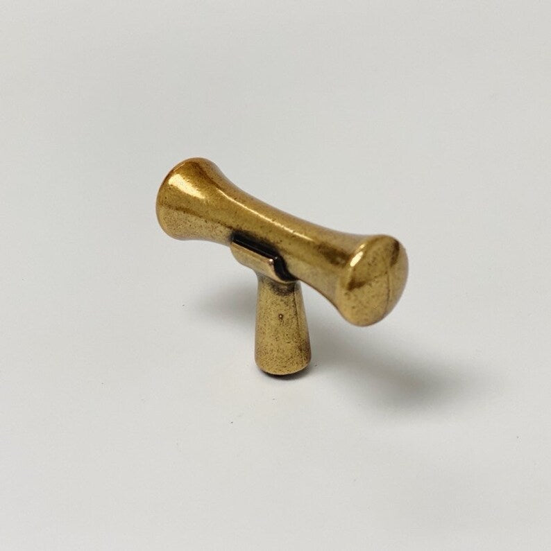 Hourglass "Tuscany" Drawer Pulls and Knobs in Antique Brass.