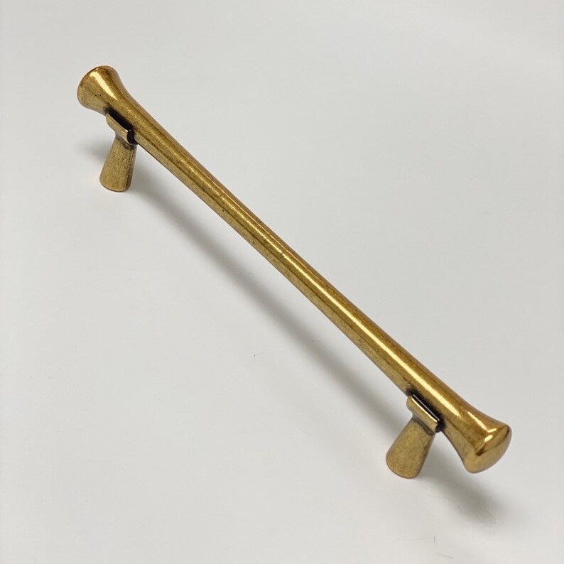 Hourglass "Tuscany" Drawer Pulls and Knobs in Antique Brass.