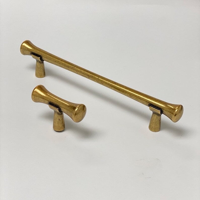 Hourglass "Tuscany" Drawer Pulls and Knobs in Antique Brass.