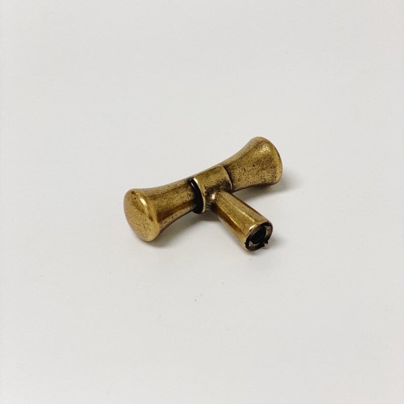 Hourglass "Tuscany" Drawer Pulls and Knobs in Antique Brass.