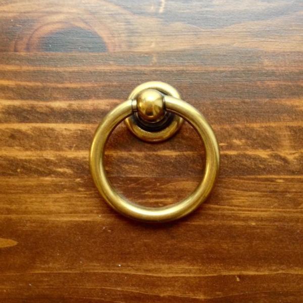 Plain Antique Brass "Capri" Ring Drawer Pulls.