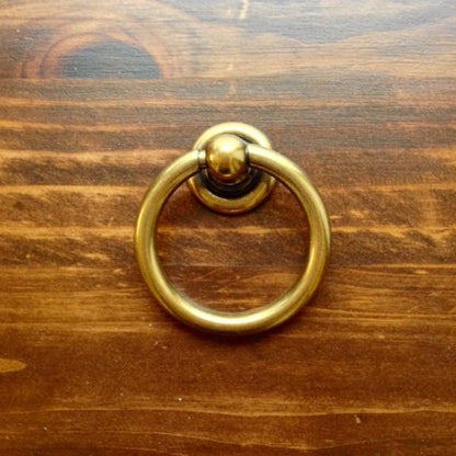Plain Antique Brass "Capri" Ring Drawer Pulls.