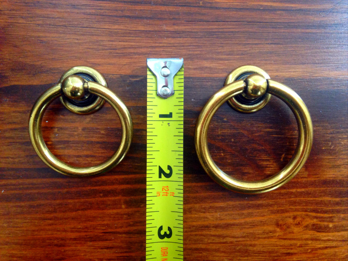 Plain Antique Brass "Capri" Ring Drawer Pulls.