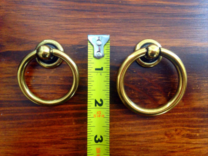 Plain Antique Brass "Capri" Ring Drawer Pulls.