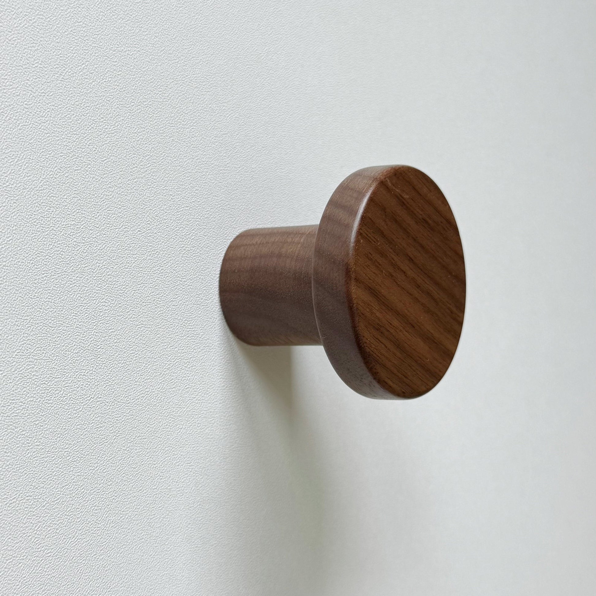 Modern "Pinta" Round Wall Hook in Lacquered Walnut.