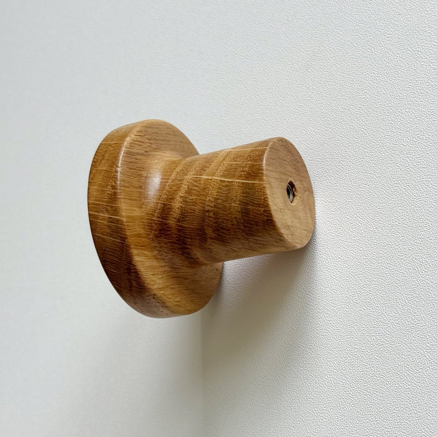 Modern "Pinta" Round Wall Hook in Lacquered Oak.