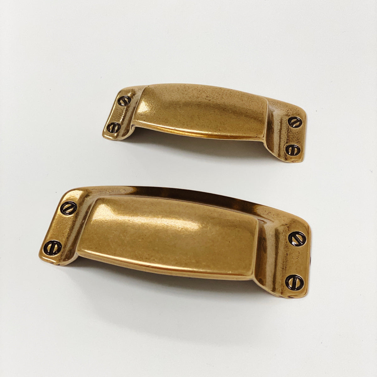 Drawer Cup Pull "Tuscany" in Antique Brass.