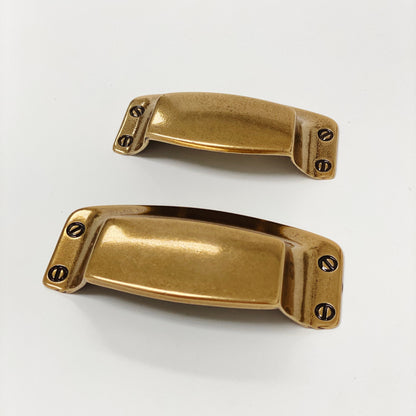 Drawer Cup Pull "Tuscany" in Antique Brass.