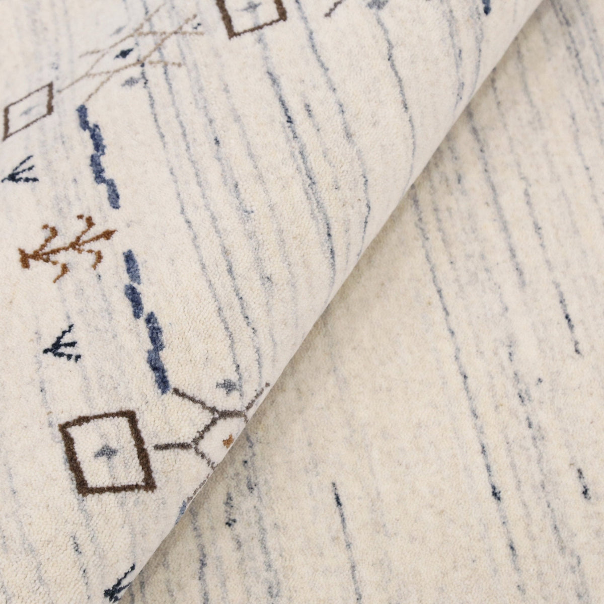 Ivory And Blue Tribal Border Design Hand Loomed Wool Area Rug.