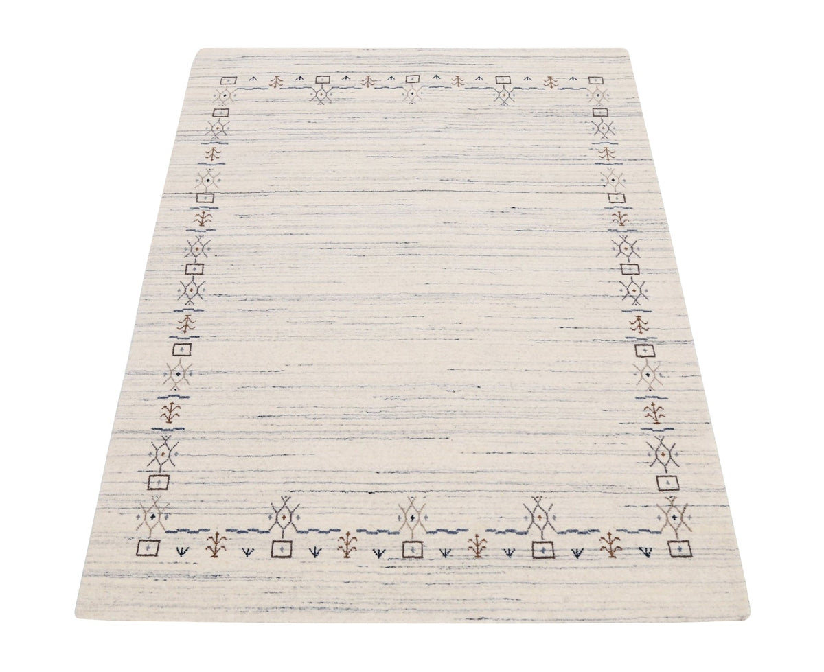 Ivory And Blue Tribal Border Design Hand Loomed Wool Area Rug.