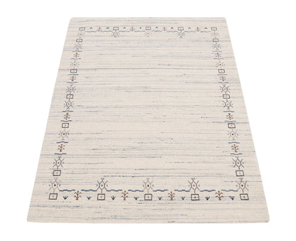 Ivory And Blue Tribal Border Design Hand Loomed Wool Area Rug.