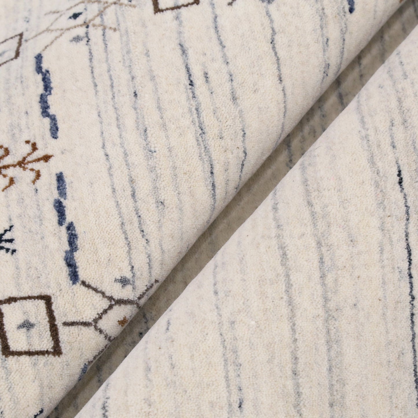 Ivory And Blue Tribal Border Design Hand Loomed Wool Area Rug.