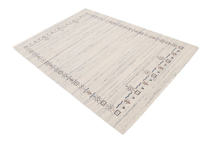 Ivory And Blue Tribal Border Design Hand Loomed Wool Area Rug.