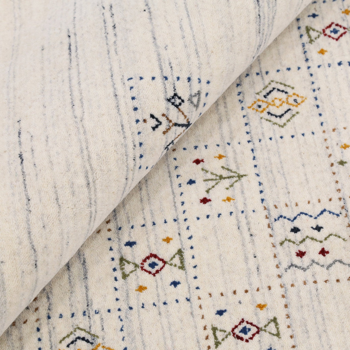 Ivory Tribal Design Hand Loomed Wool Area Rug.