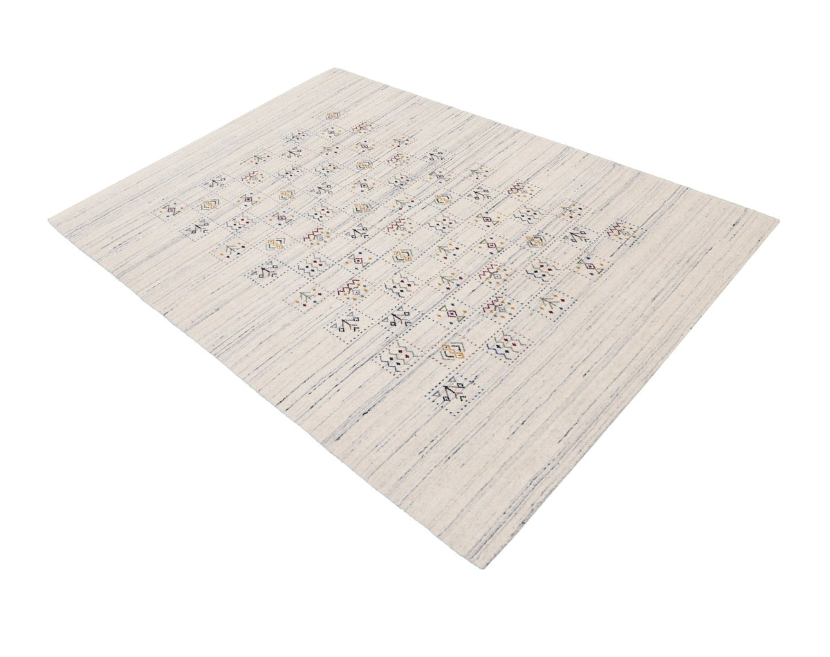 Ivory Tribal Design Hand Loomed Wool Area Rug.