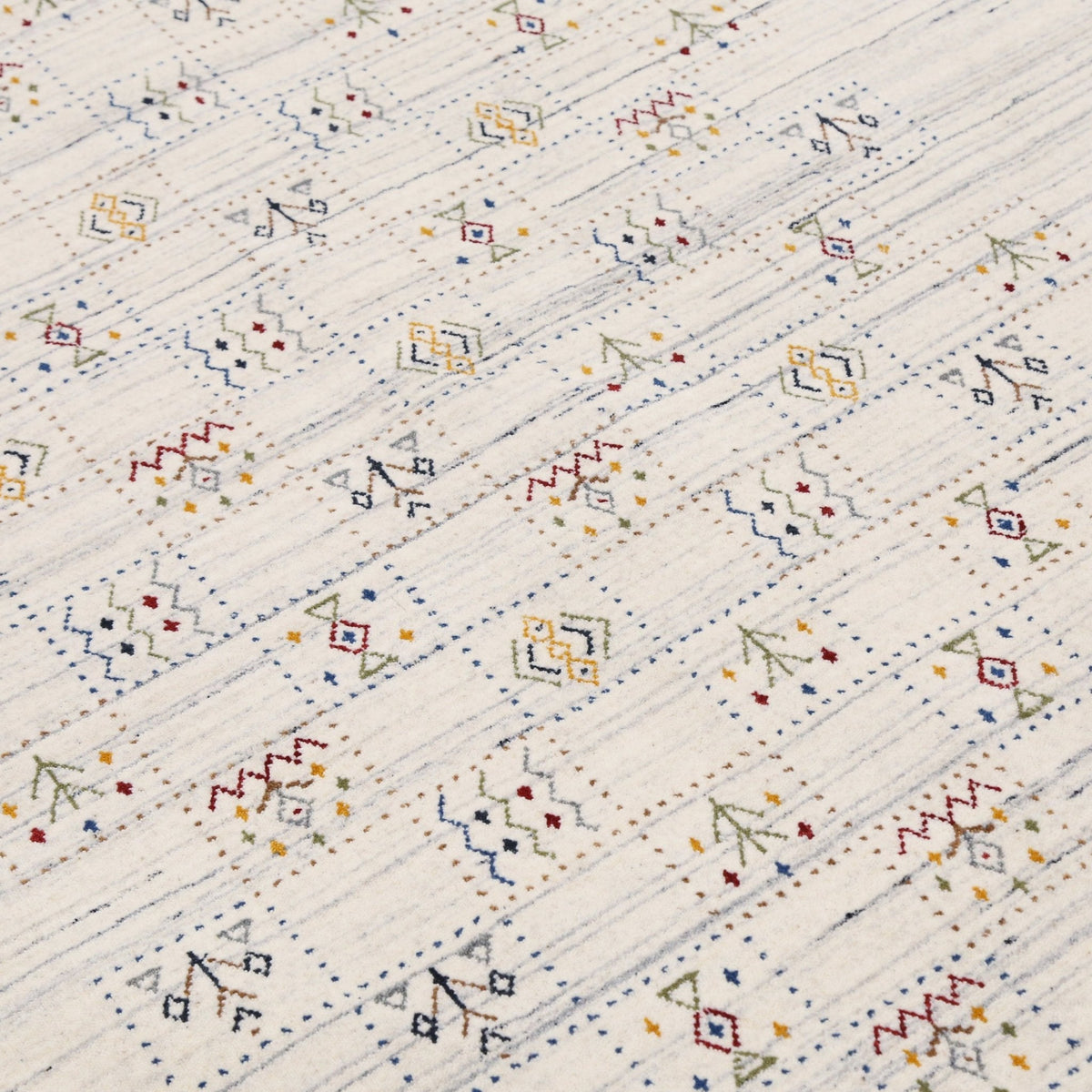 Ivory Tribal Design Hand Loomed Wool Area Rug.