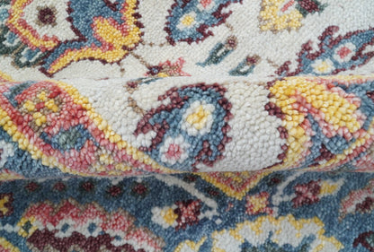 Kelly Turkish Design Ivory And Blue Hand Knotted Wool Rug.