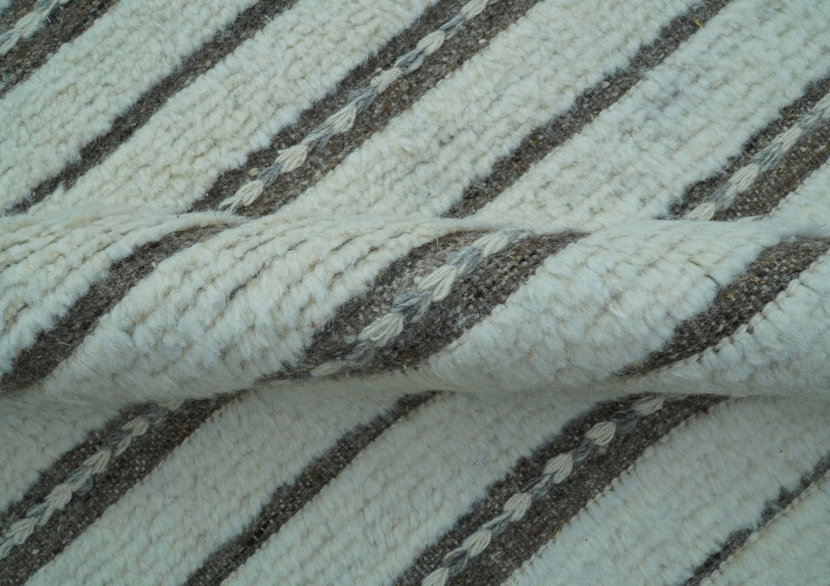 Krabi Contemporary Ivory And Brown Hand Knotted Wool Rug.