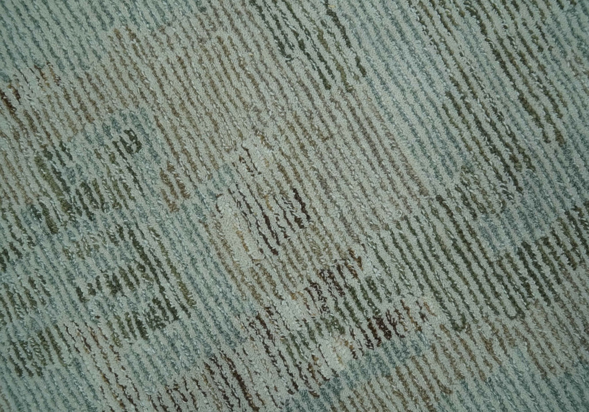 Modern Abstract Teal, Olive and Ivory Hand Tufted Multi Size wool area rug.