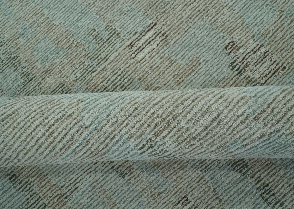 Modern Abstract Teal, Olive and Ivory Hand Tufted Multi Size wool area rug.