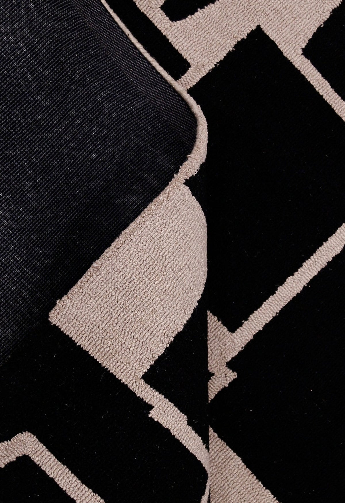 Modern Geometrical Black Hand Tufted Wool Area Rug.