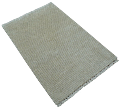Modern Solid Design Beige Hand Knotted Wool And Silk Rug.