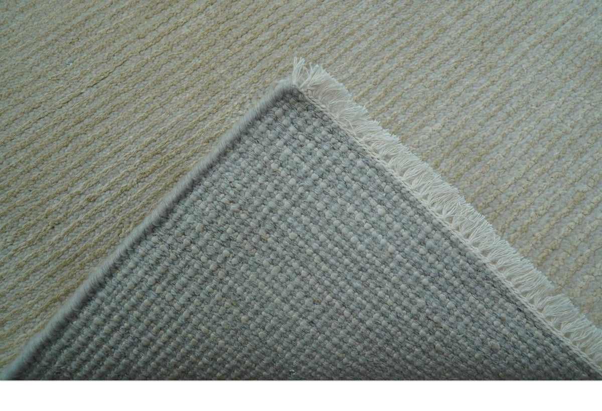Modern Solid Design Beige Hand Knotted Wool And Silk Rug.