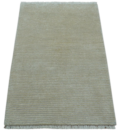 Modern Solid Design Beige Hand Knotted Wool And Silk Rug.
