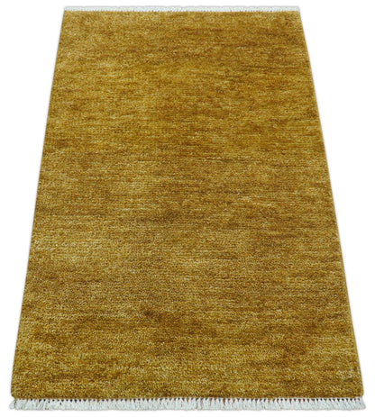 Modern Solid Design Gold Hand Knotted Wool Area Rug.