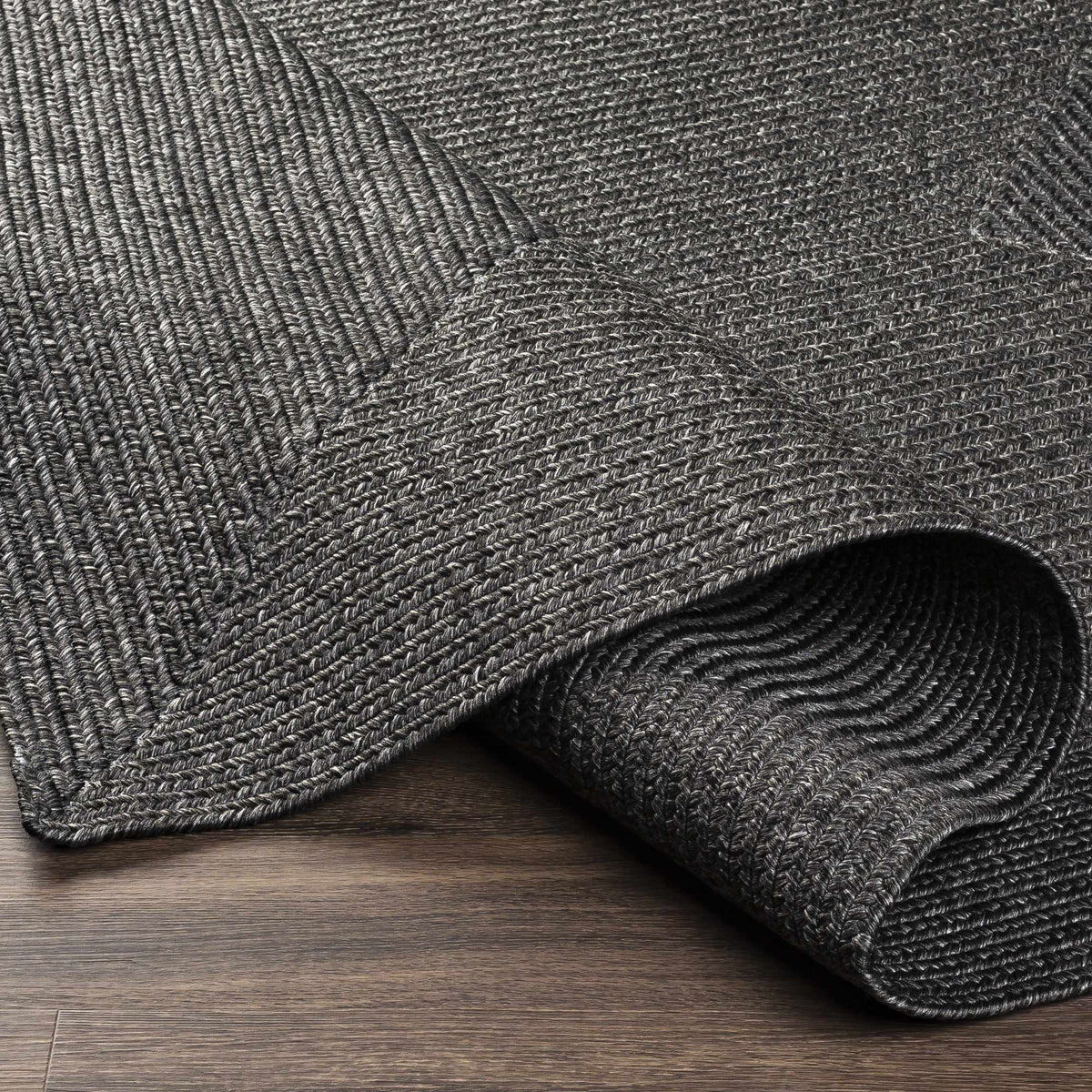 Black Braided Faux Jute Outdoor Rug.