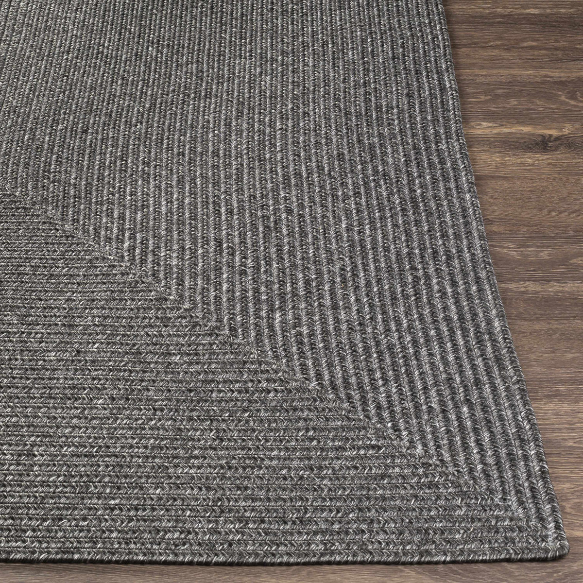 Black Braided Faux Jute Outdoor Rug.