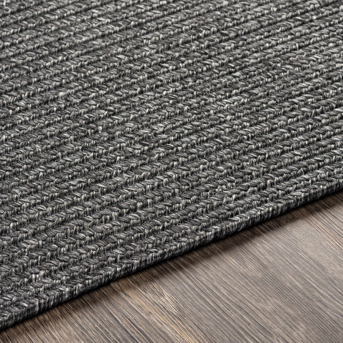 Black Braided Faux Jute Outdoor Rug.