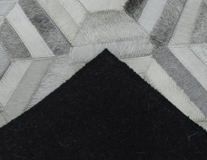 Modern Handmade Ivory and Silver Genuine Leather Area Rug.