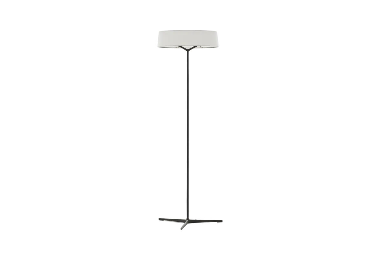 Floor lamp with a white shade on a beige textured wall background
