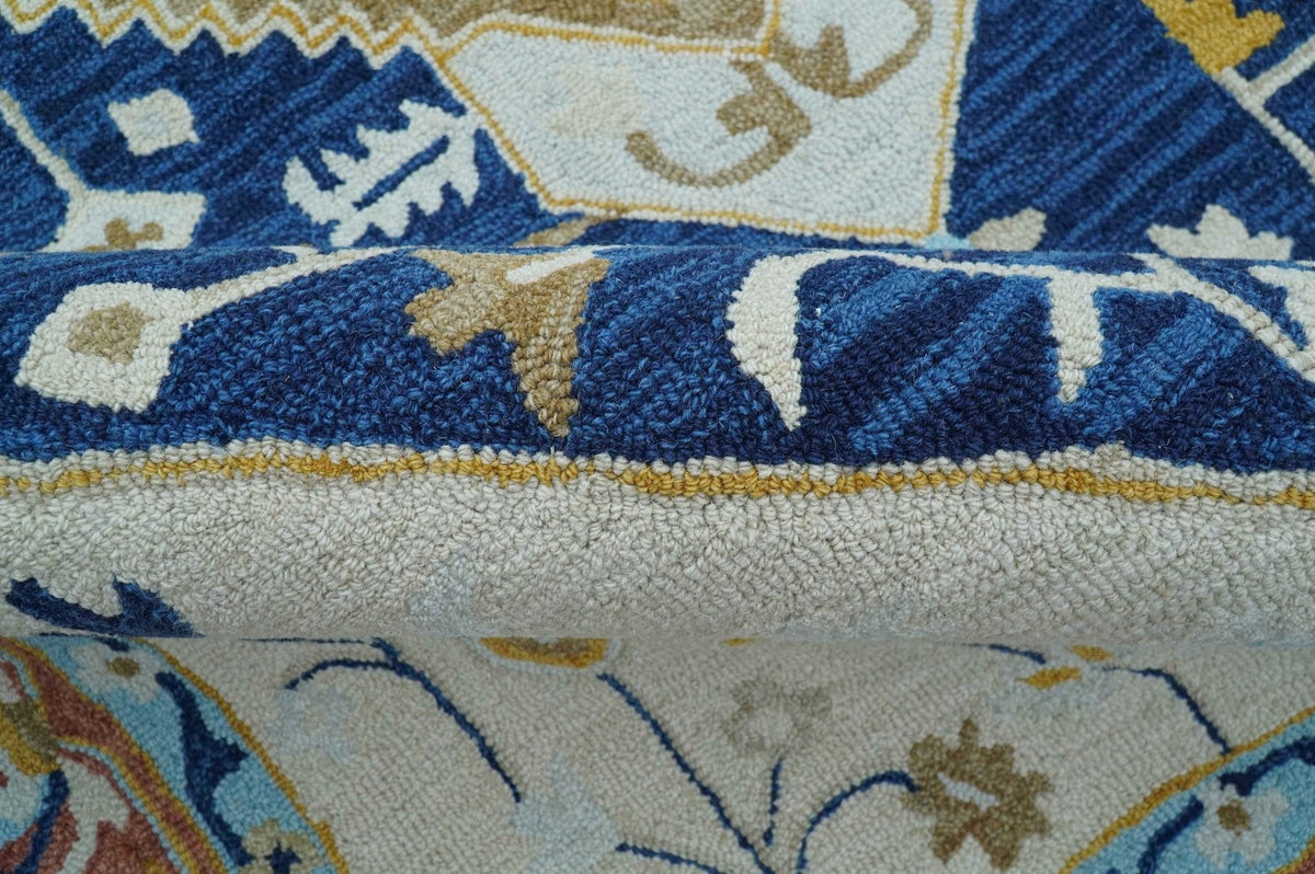 Ollie Traditional Blue And Ivory Hand Tufted Wool Rug.