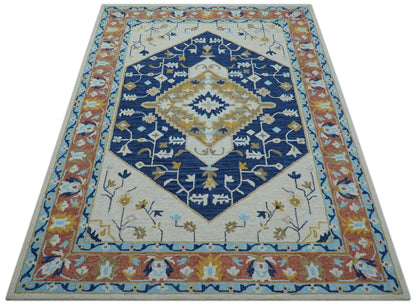 Ollie Traditional Blue And Ivory Hand Tufted Wool Rug.