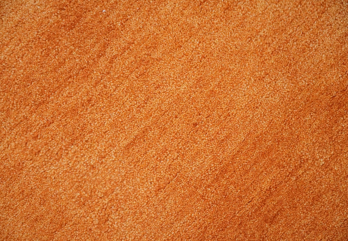 Custom Made orange Solid Woolen Hand Tufted contemporary area Rug.