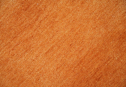 Custom Made orange Solid Woolen Hand Tufted contemporary area Rug.