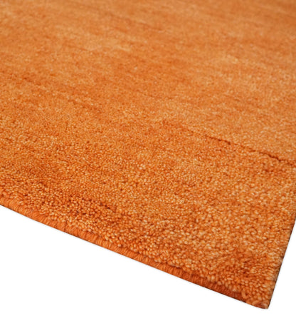 Custom Made orange Solid Woolen Hand Tufted contemporary area Rug.