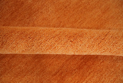 Custom Made orange Solid Woolen Hand Tufted contemporary area Rug.