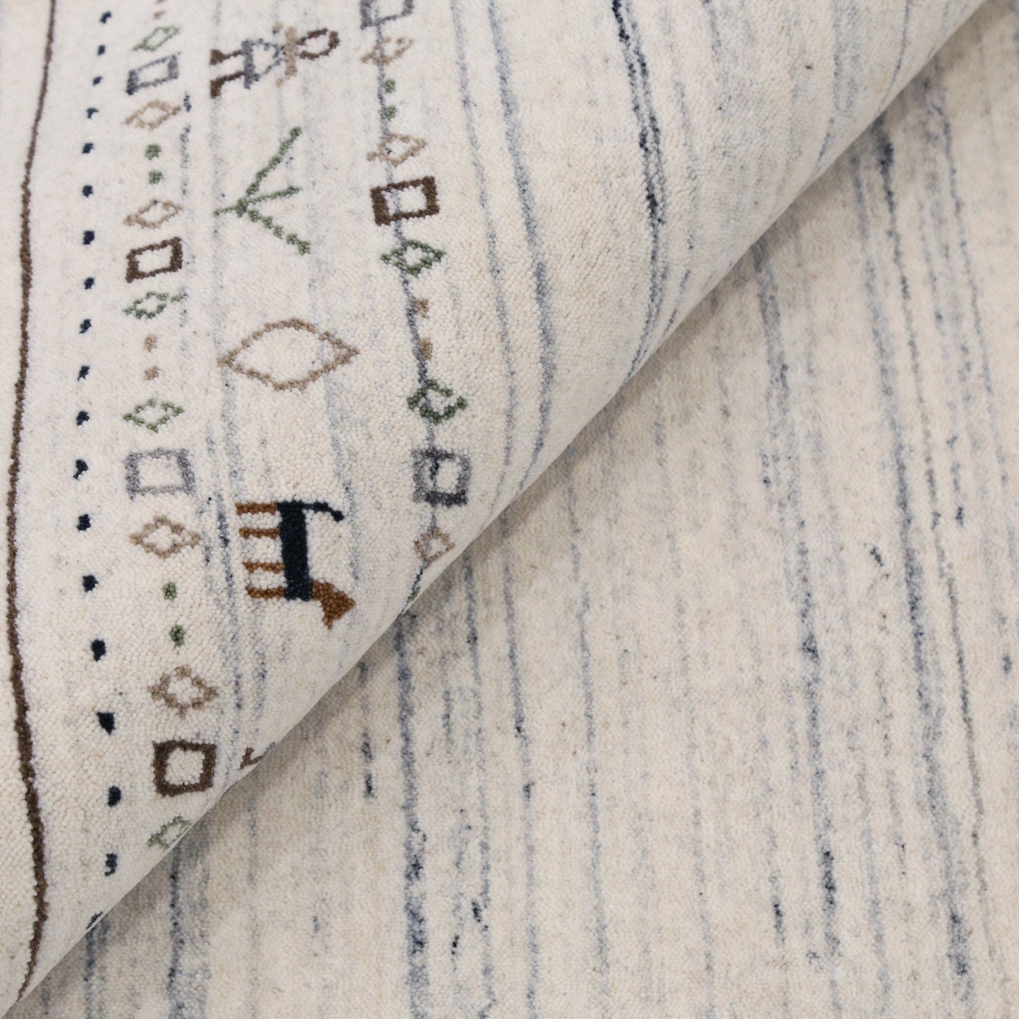 Contemporary Ivory Design Hand Loomed Wool Rug.