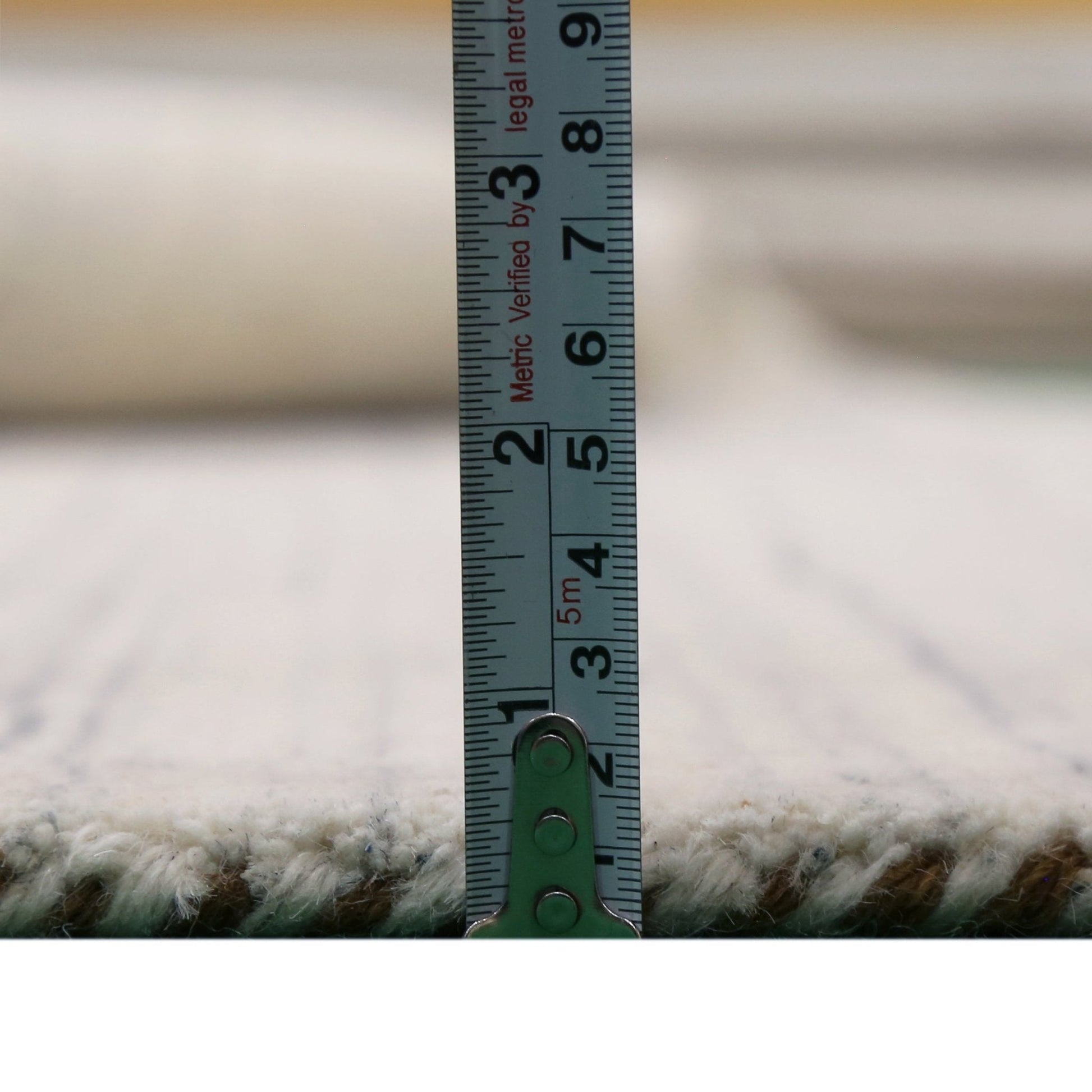 Contemporary Ivory Design Hand Loomed Wool Rug.